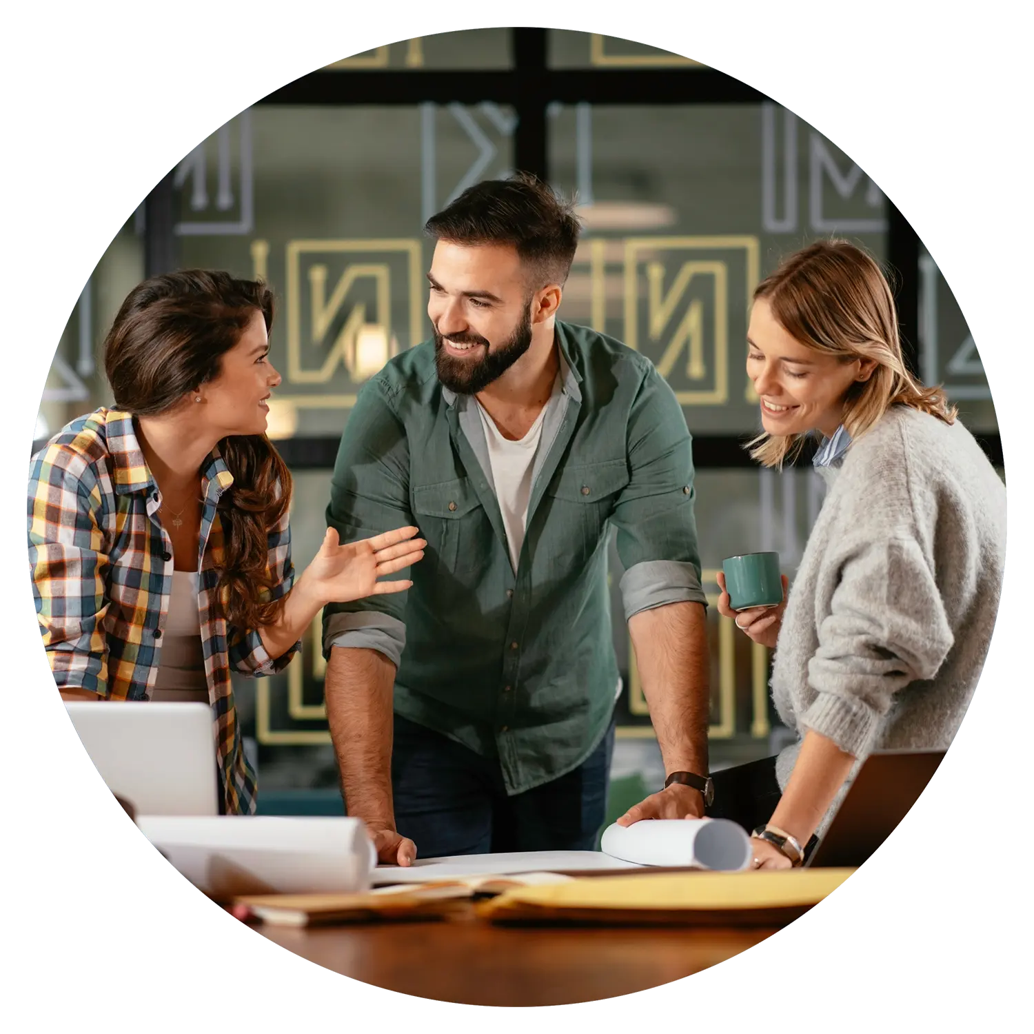 Image of a man and two women working together representing representing the benefits of working with both strategy and operations consultants simultaneously.