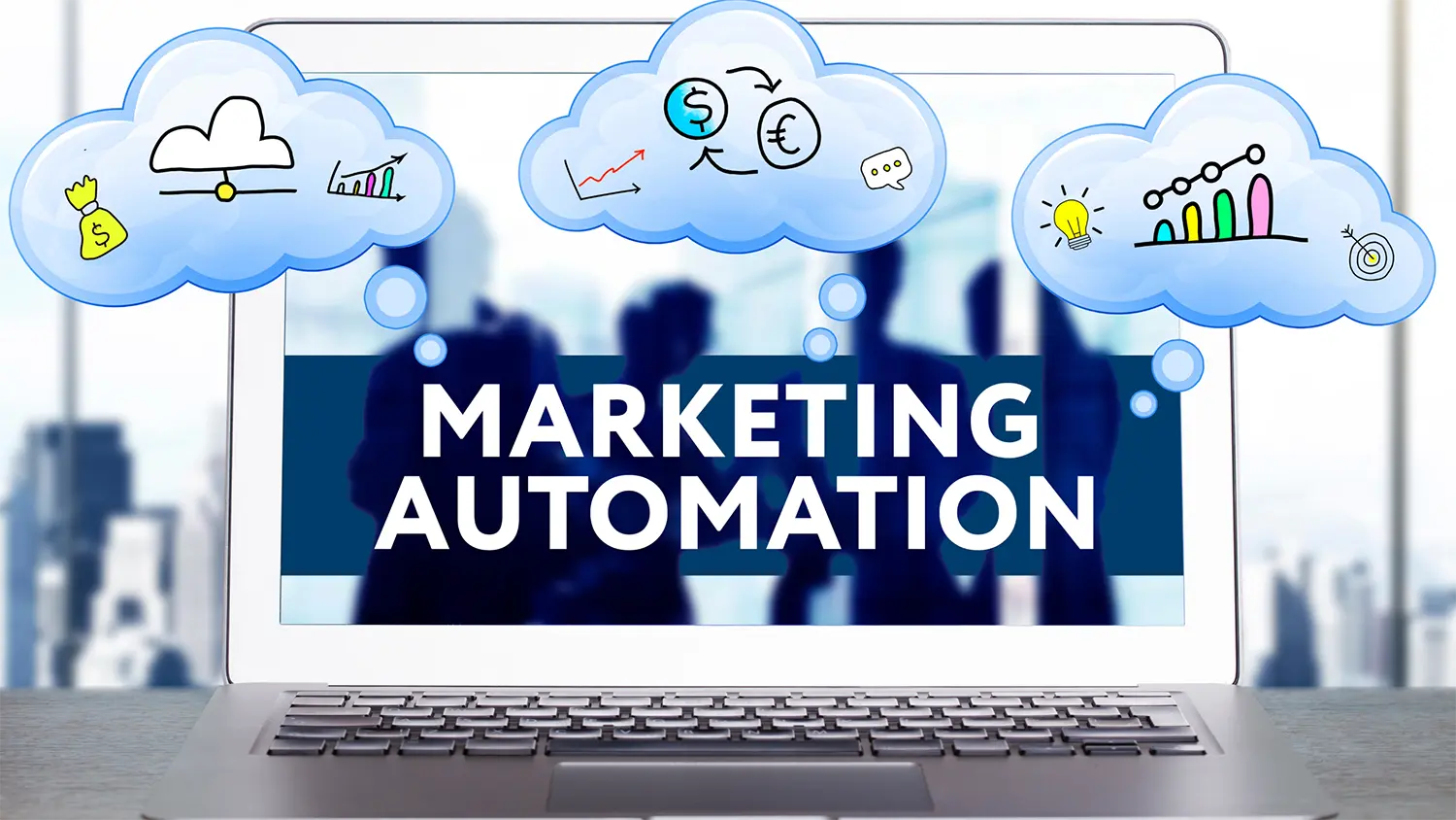 Image of a laptop reading marketing automation with three text clouds filled with marketing icons.