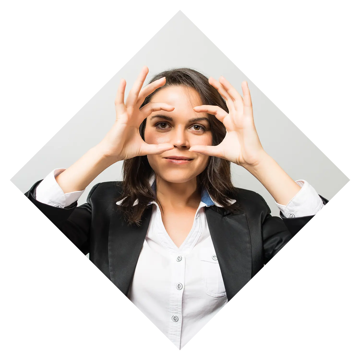 Image of a businesswoman using her hands as binoculars.