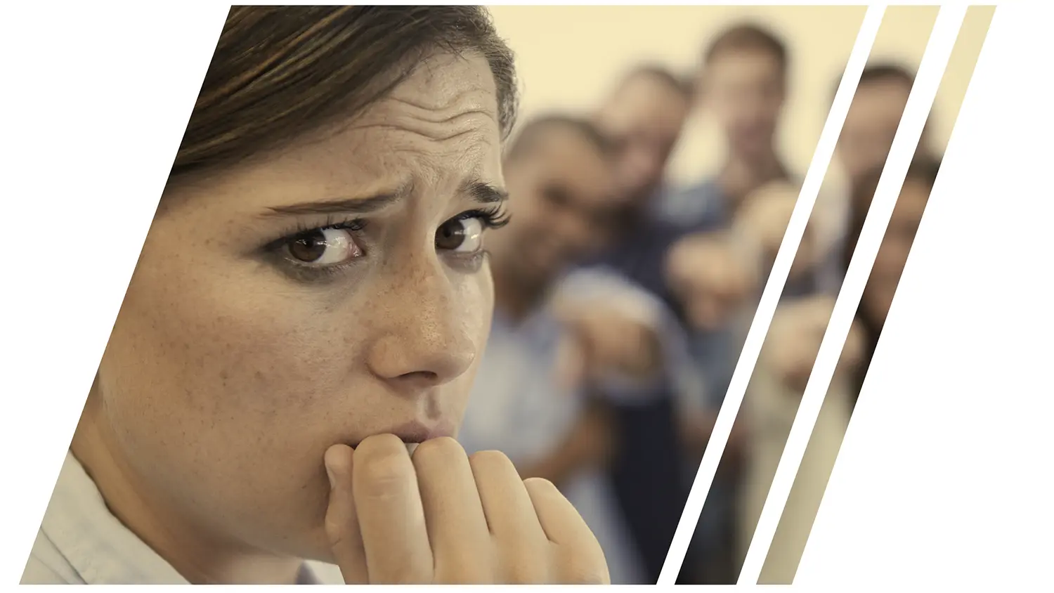 Image of a businesswoman looking concerned with her team behind her.